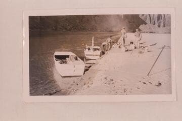 On the Colorado near Mile 23.  Leaning over is Sam Stone, then Frank E. Frost, Robert L. Gates and San Juan Jack.  Second trip of Frost Expeditions on the San Juan River
