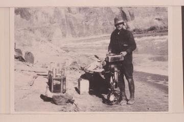 Pat Flattum and the Indian motor used in Glen Canyon trip.  Note the dangerous "authority boots" and the choke-bored breeches