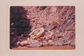 The wrecked "Donz," Don Harris's boat, below Hance Rapid.  The boat was wrecked by the rough water in Hance Rapid, but there were no casualties