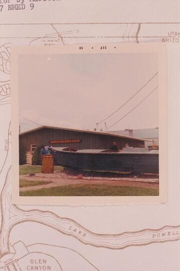 Nate examines the Powell boat at the Museum at Page.  The "Emma Dean" according to Disney