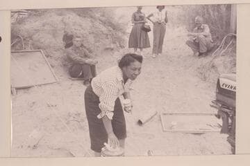 Lodell Matthews offers a drink of cold water.  Preston Mercer sitting left.  Dick Spring sitting right.  Margaret Marston and Dudy Thomas background center.  Lees Ferry