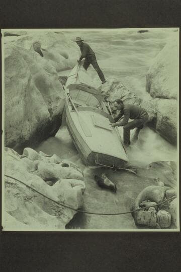 Lava Cliff Rapid, Mile 246. The USGS party arrived at the rapid Oct. 11, 1923 and portaged it Oct. 12, 1923. One of the boats appears moored at the shore